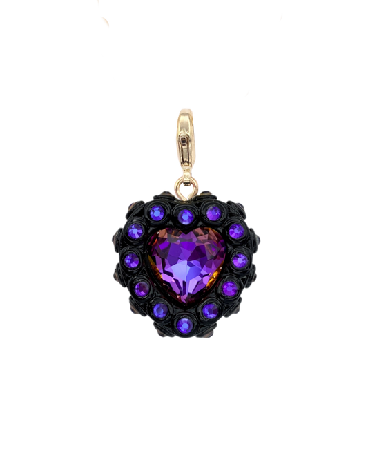 Heart-shaped pendant with purple gemstone and gold accents on a white background
