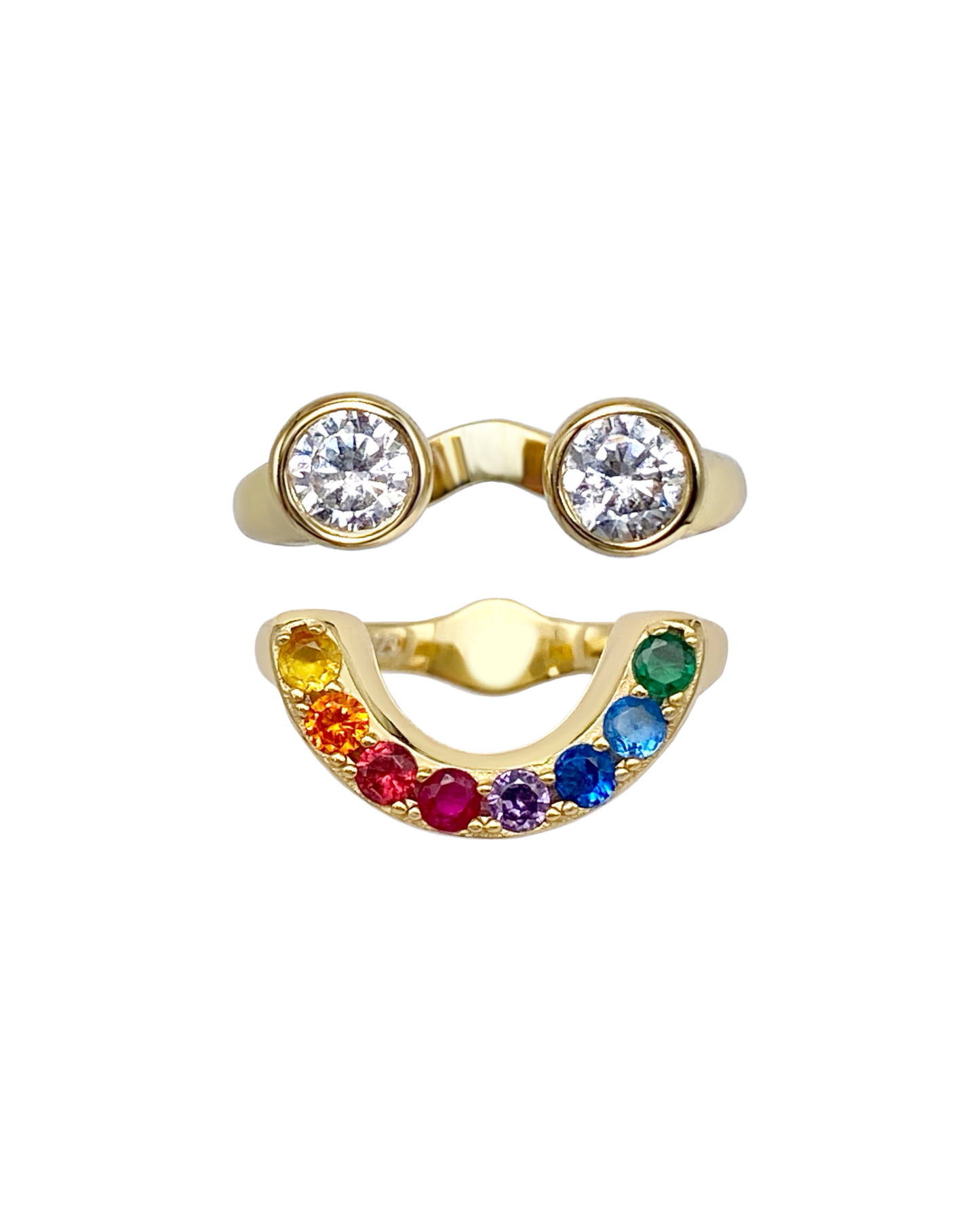 Gold ring with two circular gemstones and a rainbow-colored gemstone band that together form a smiley face ring set.