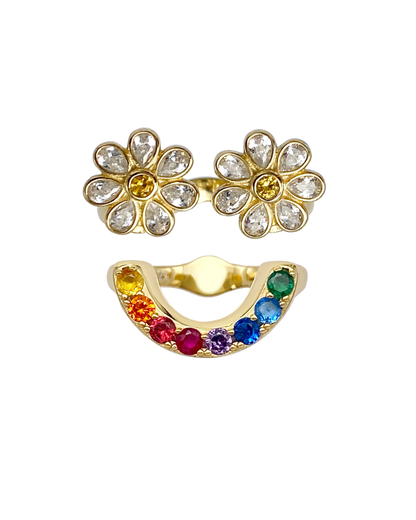 Gold flower-shaped earrings with clear stones and a gold ring with colorful gemstones on a white background.