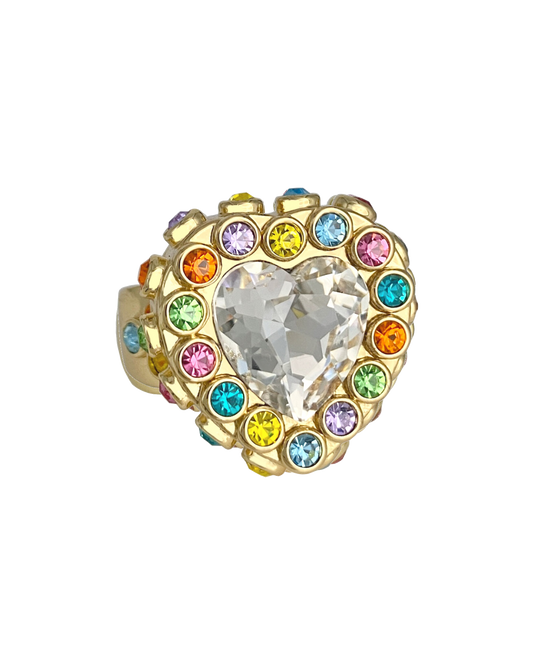 Heart-shaped ring with colorful gemstones on a white background
